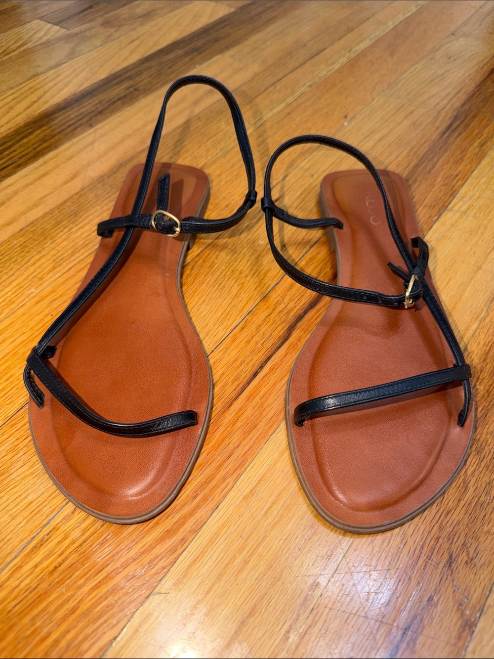 Aldo Black Strappy Flat Sandals with Brown Footbed